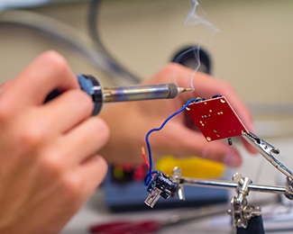 student soldering