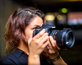 student with a camera