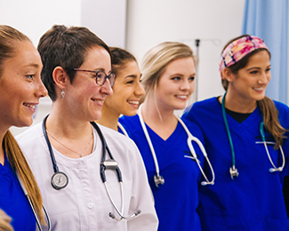 nurses with a faculty member