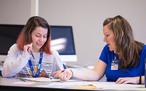 student talking to a professor