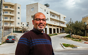 Alumni in front of a building