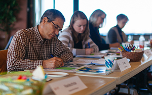 adult students taking notes