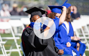 grad student with play button