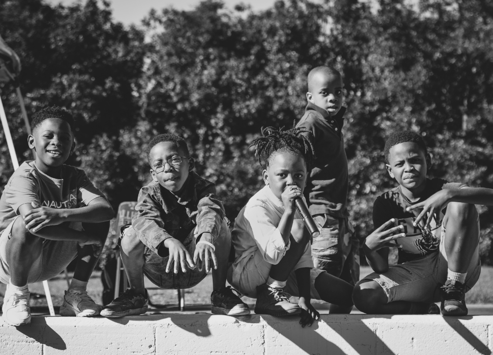 children sit in a row