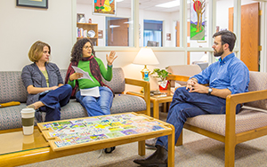 students talking with faculty