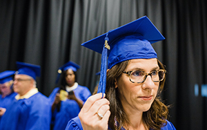 Student fixing her tassle