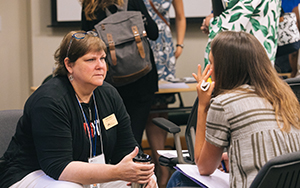 Professor listening to a student