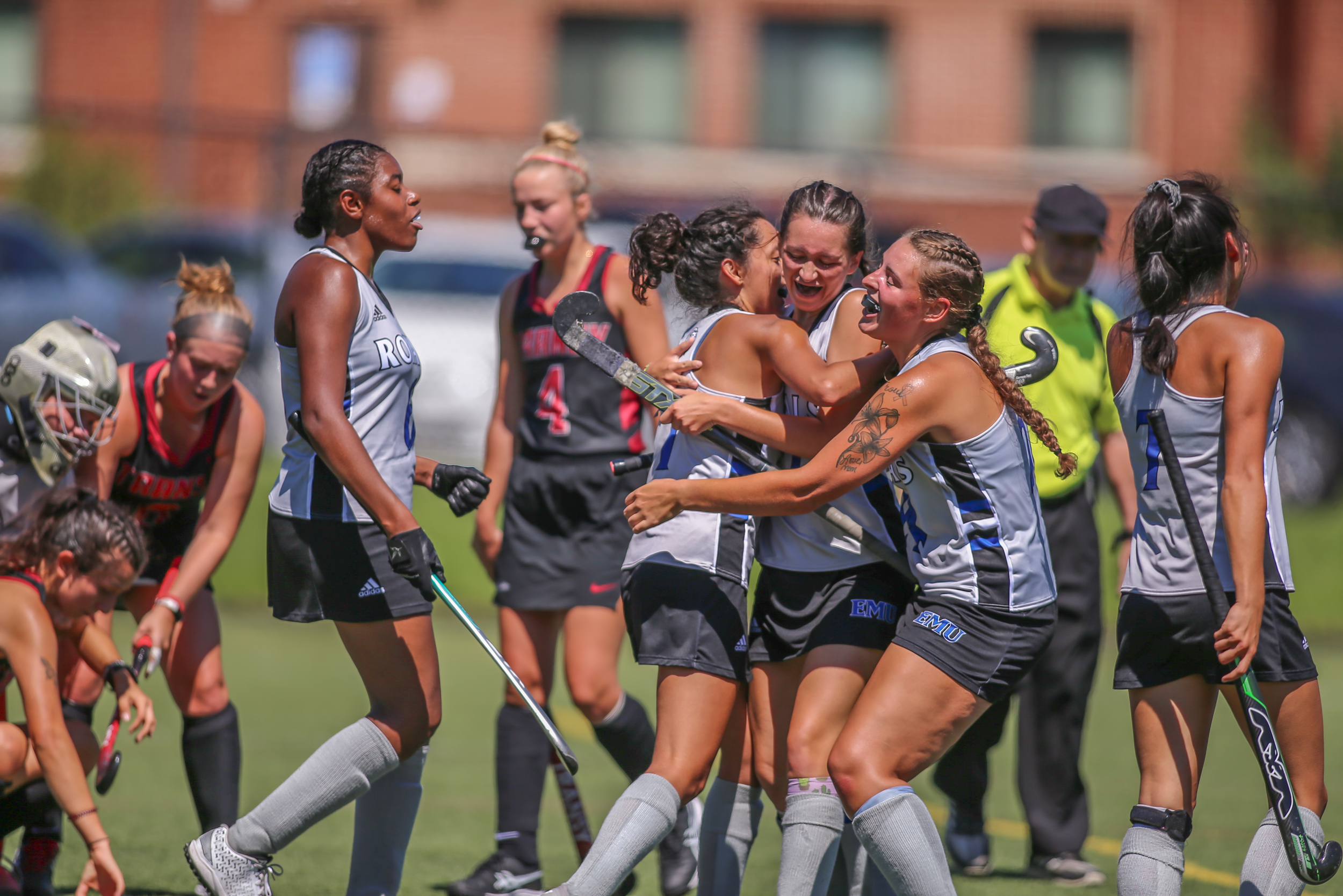 EMU field hockey celebrating