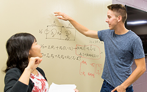 student and professor looking at some math for engineers