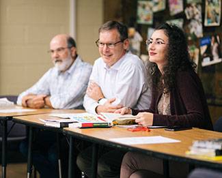 student and mentor in a classroom
