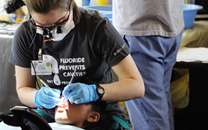 Dentist cleaning someone's teeth