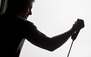 person using an arm band to strengthen arm