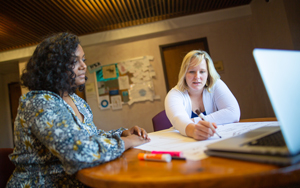 nurse talking to younger nurses