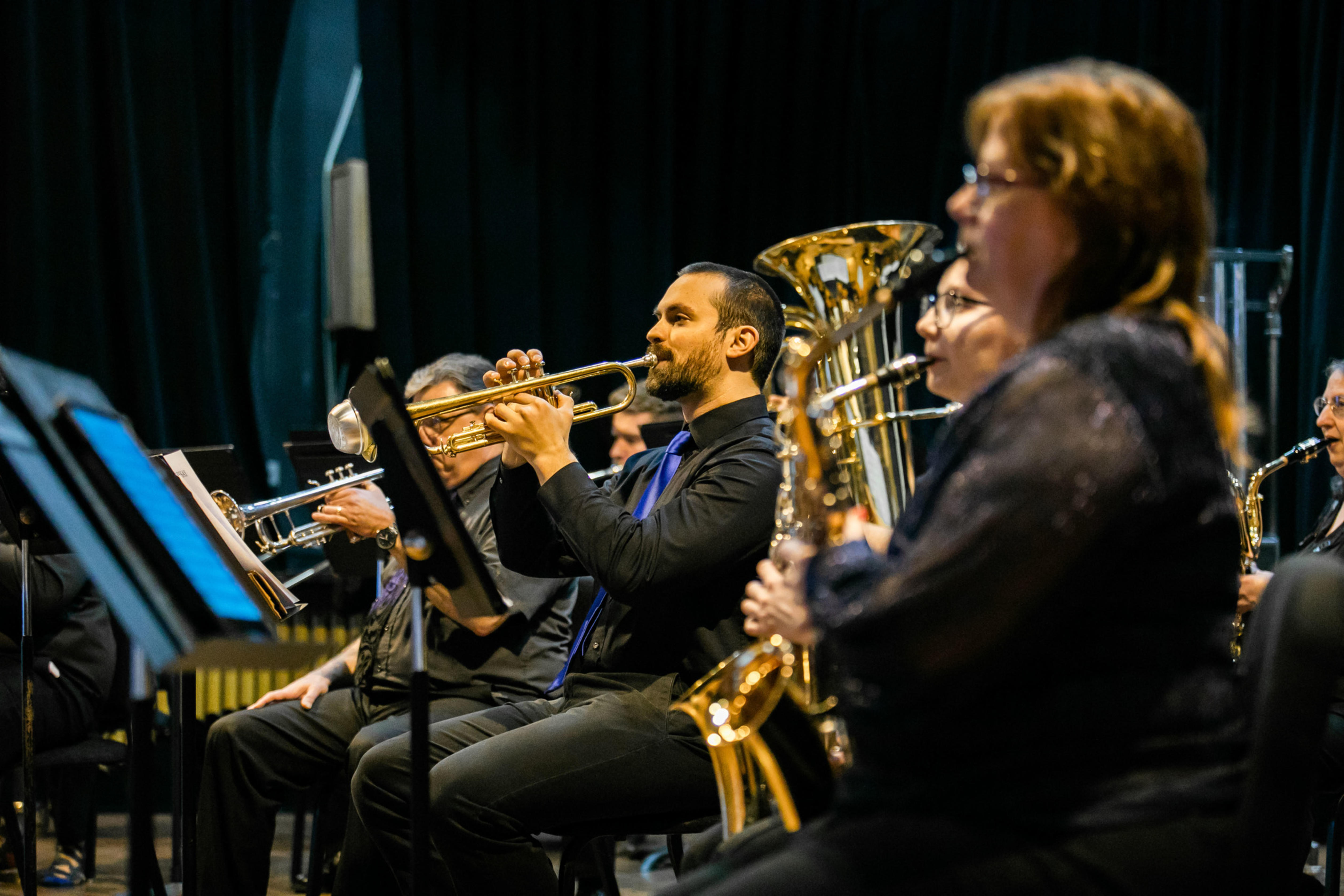 student playing a clarinet at a concert