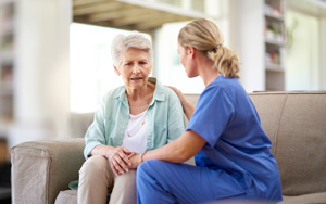 nurse comforting woman
