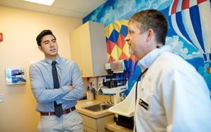 RJ Ocampo, PPHS student, having a conversation with a doctor