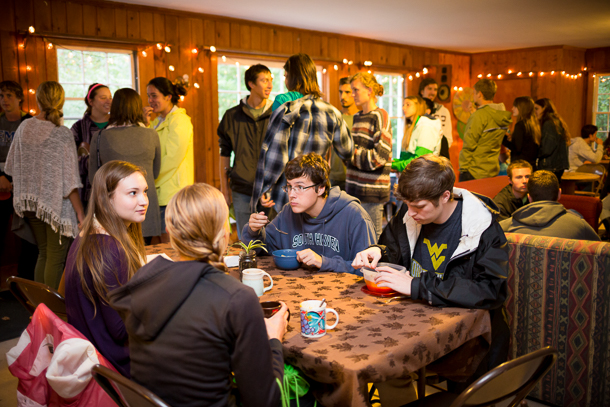 Inside the Park Woods cabin as students gather for a meal