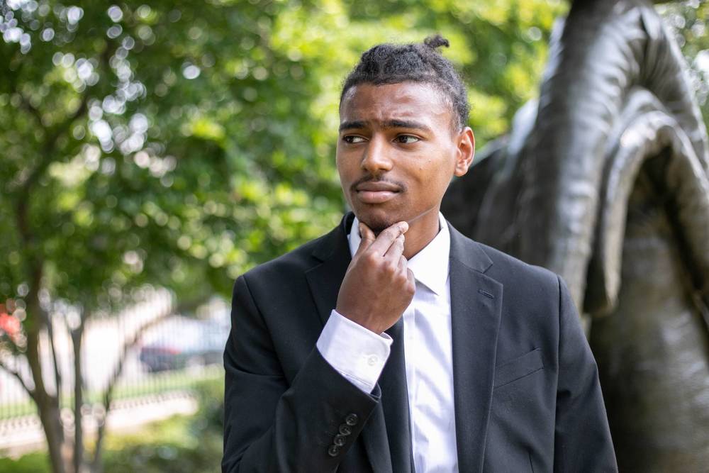 student looking at art