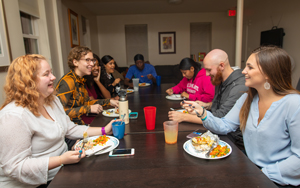students eating dinner together
